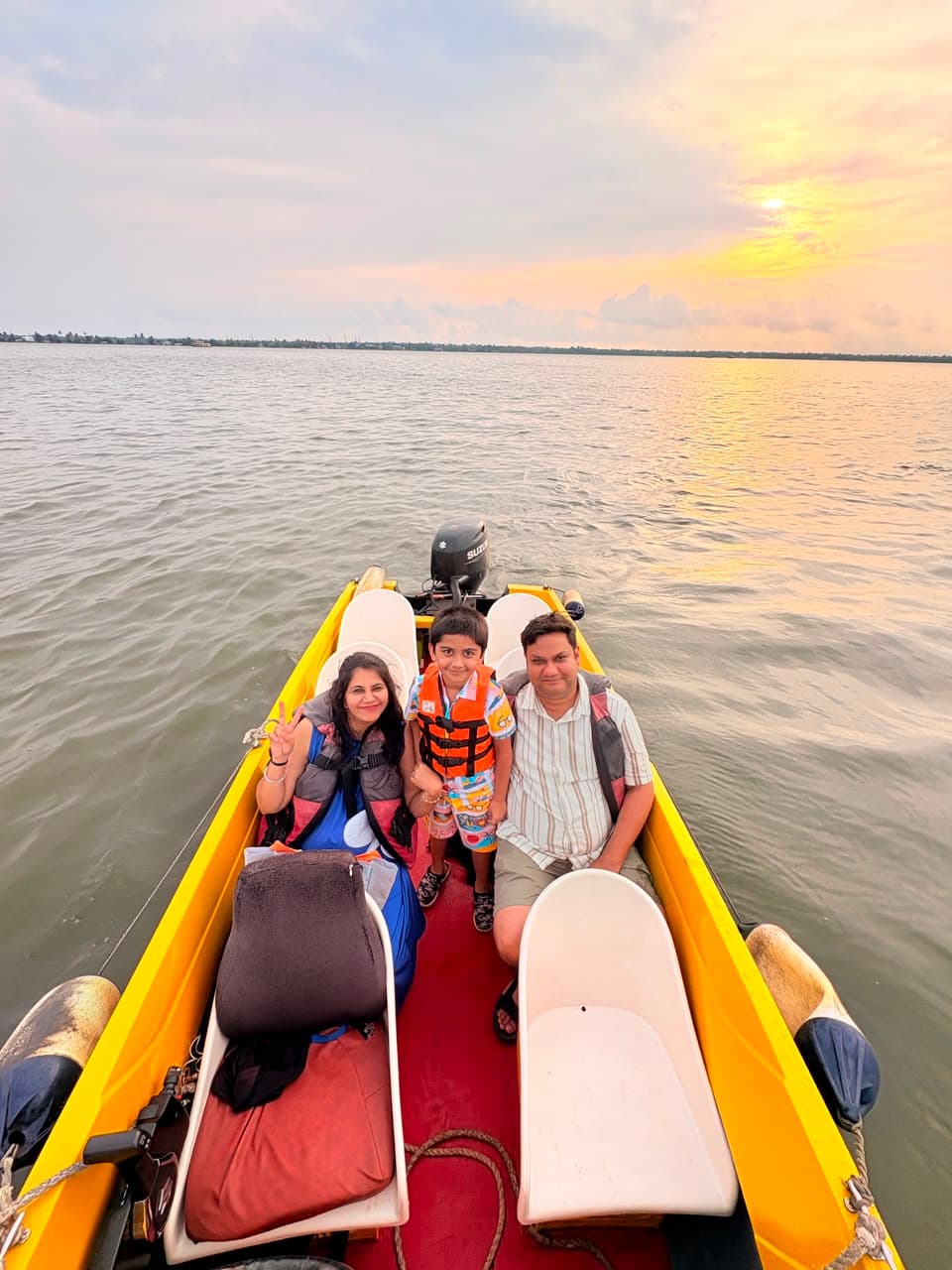 Speed boat riders at Punnamada Lake backwaters Alleppey